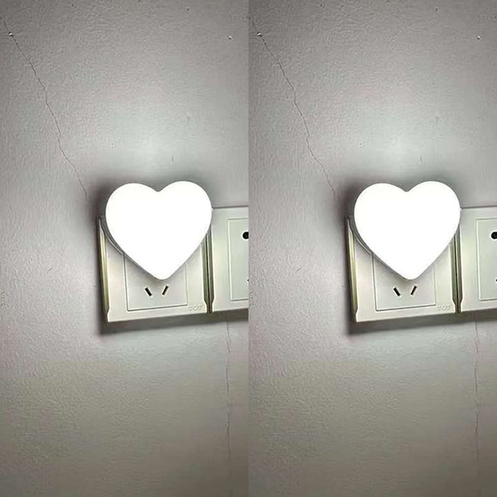 Heart-shaped plug-in ambient night light with soft LED lighting
