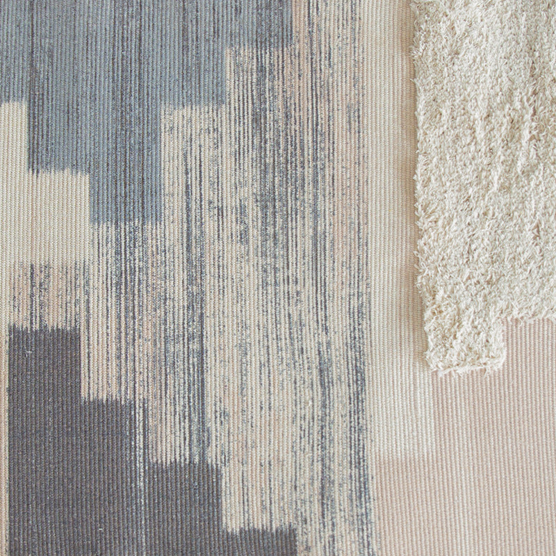 Modern structured living rug with partial shag application and abstract stripe pattern
