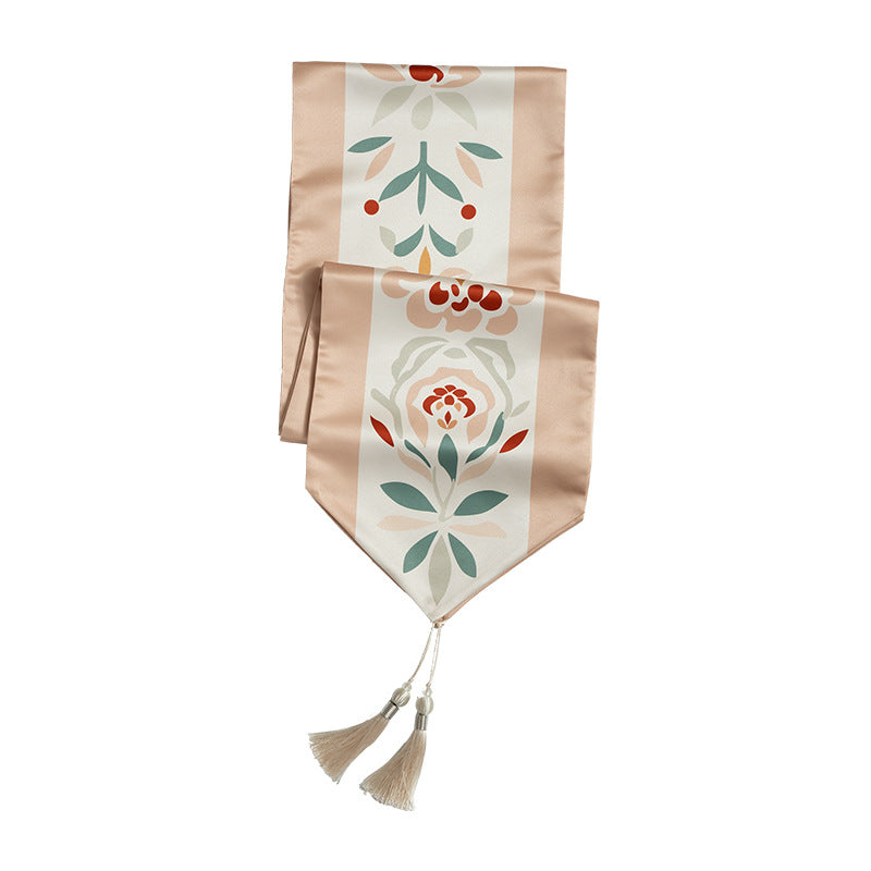 Handcrafted satin table runner with Oriental medallion pattern and decorative tassels