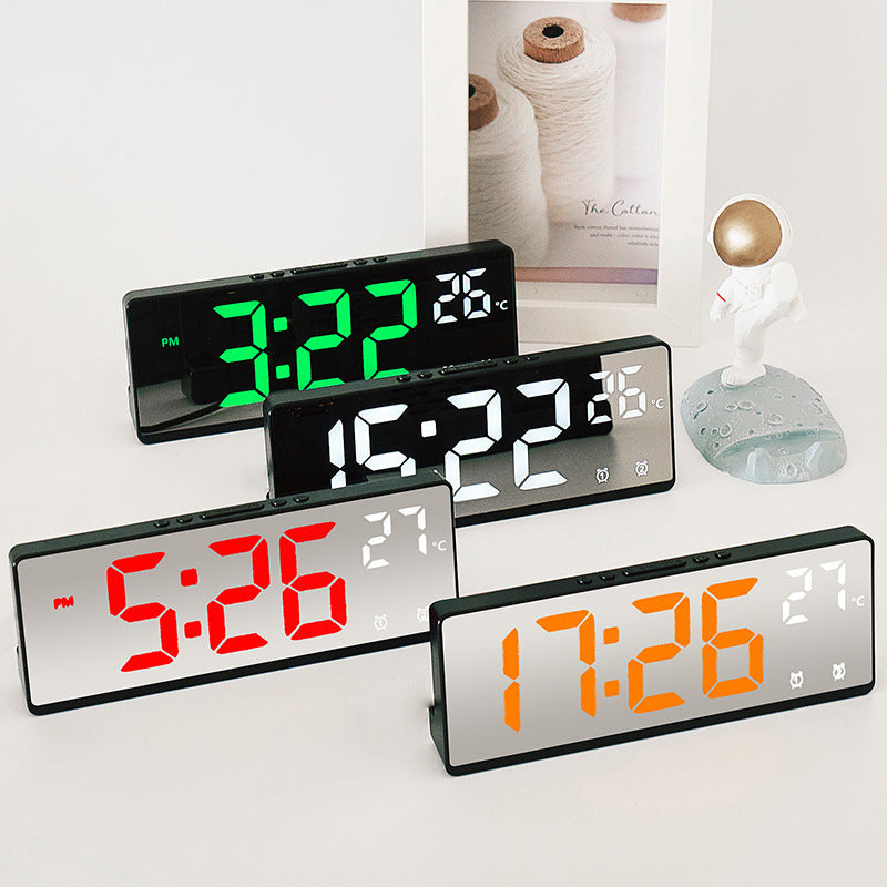 Digital alarm clock with mirror display and temperature function