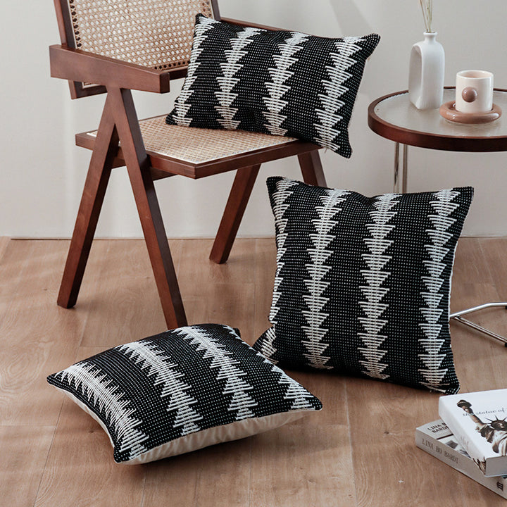Square woven decorative cushion cover in tribal jacquard with pom-pom corners
