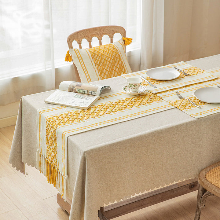 Handwoven cotton table runner with ethnic diamond pattern and fringes