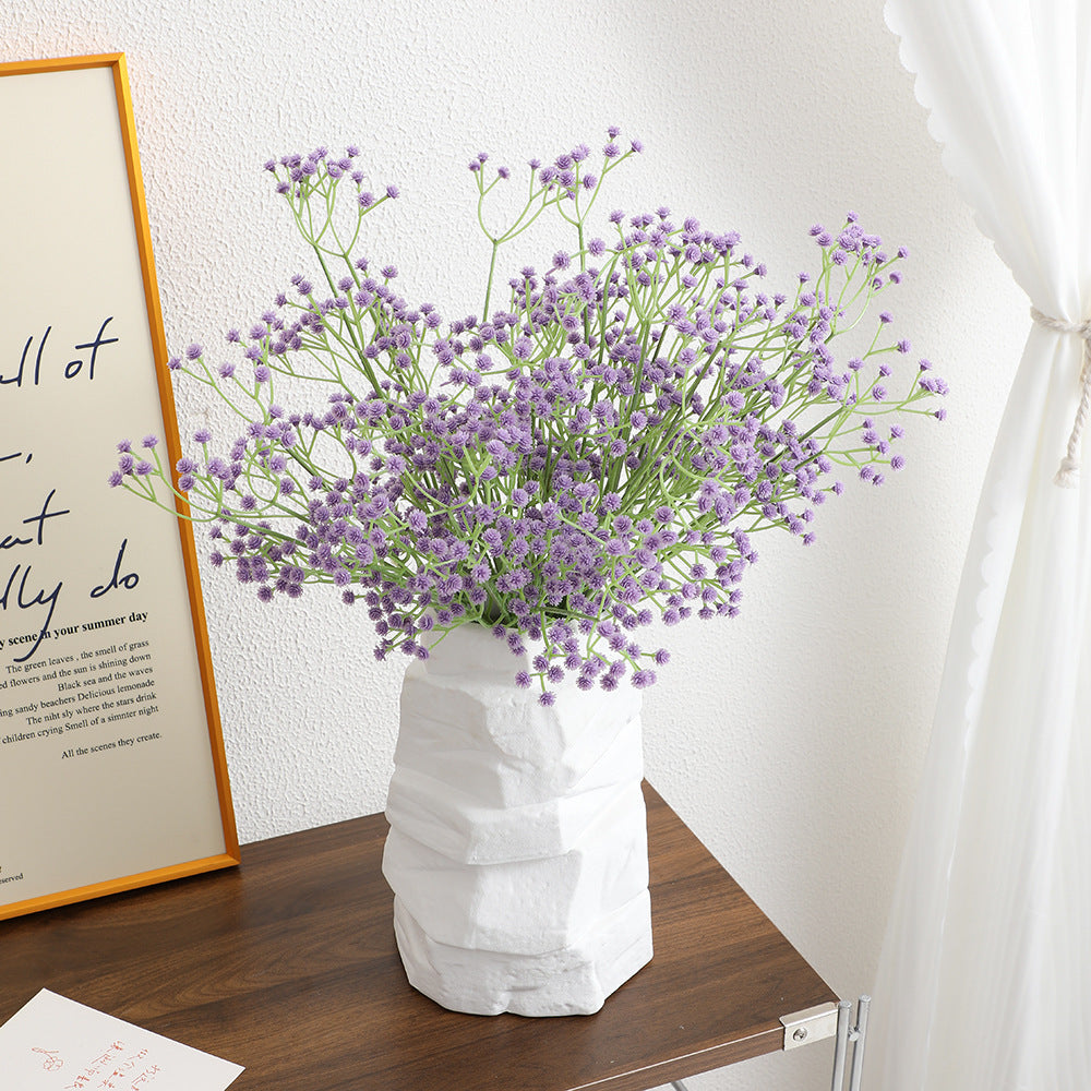 Decorative artificial flower branch with fine purple flowers
