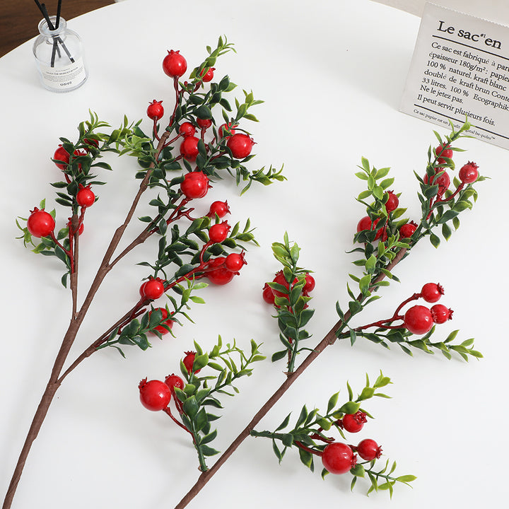 Artificial branch with glowing red berries