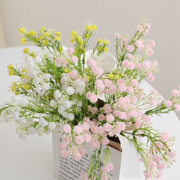 Decorative artificial flower branch with delicate purple flowers