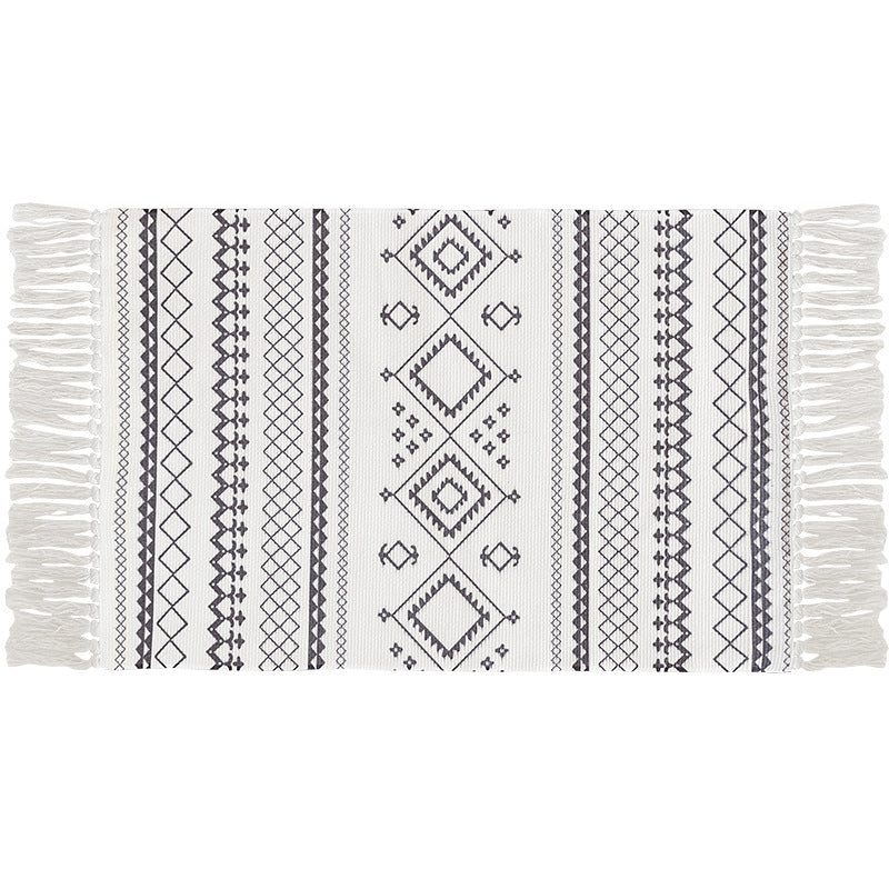 Flat-woven cotton carpet runner with ethnic diamond pattern and decorative fringes