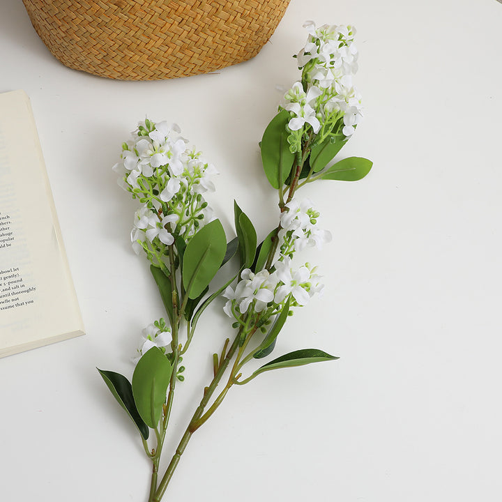 Artificial flower branch with bright flowers