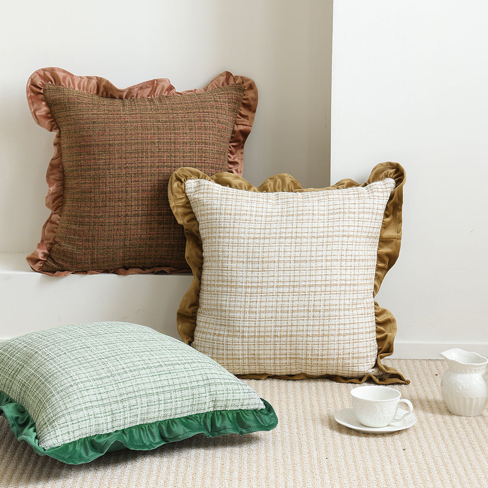 Decorative cushion with woven bouclé structure and velvet ruffled edge