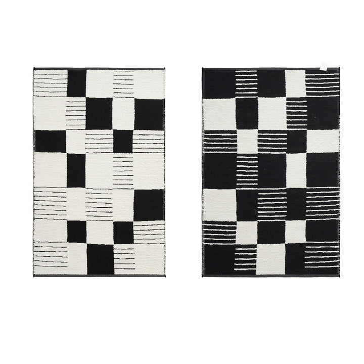Modern runner rug with graphic checkerboard pattern and short pile structure