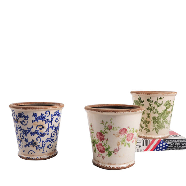 Decorative ceramic flower pot with floral design
