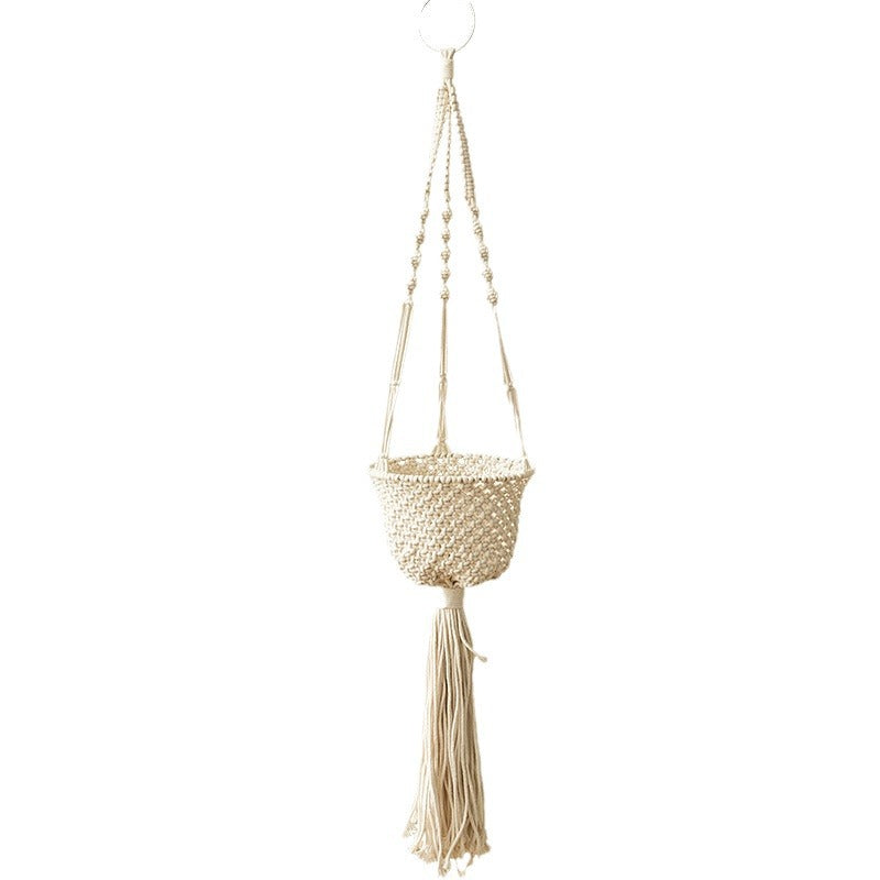 Macrame plant hanger made of cotton rope with tassels and adjustable suspension