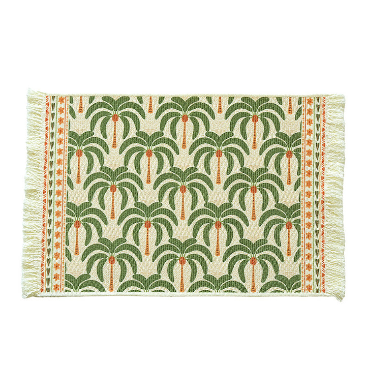 Rectangular woven rug in tropical palm pattern with flat weave and fringes