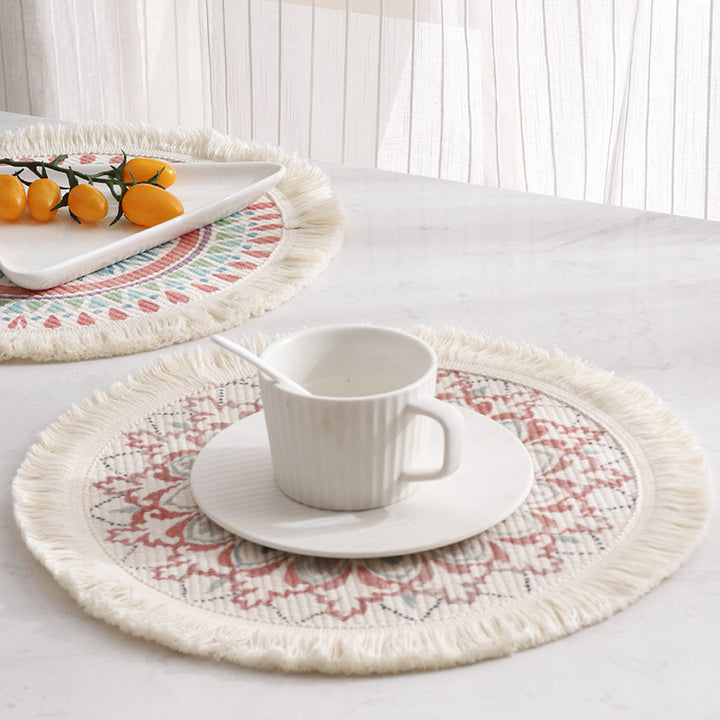 Round flat-woven cotton rug with mandala design and decorative fringes