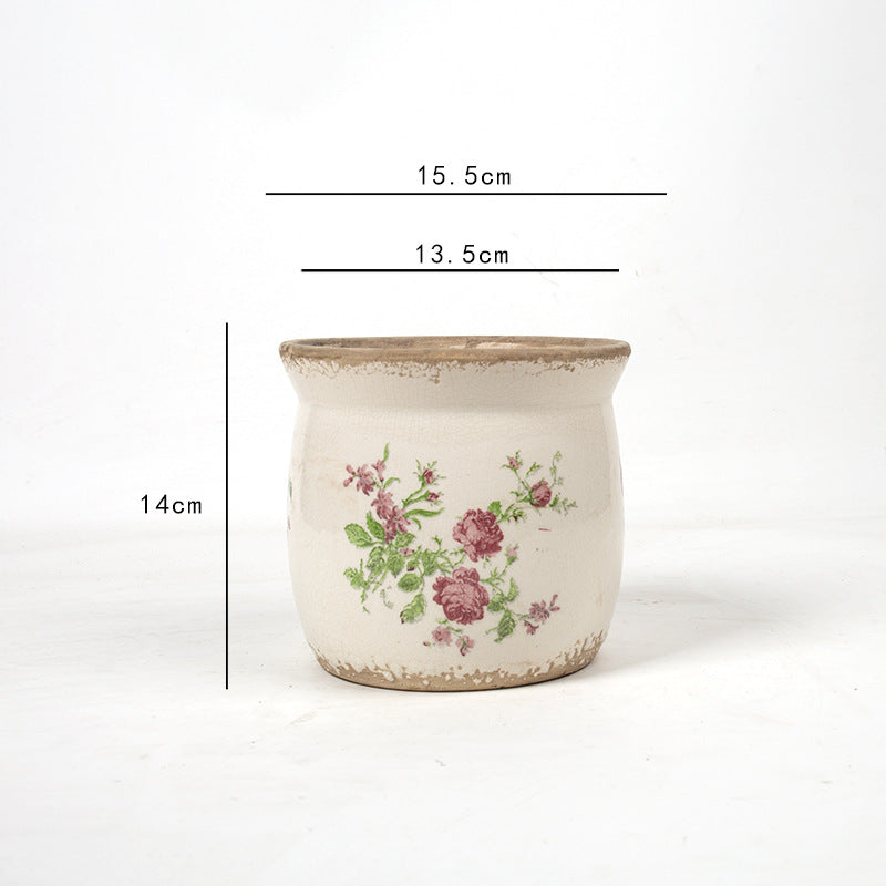 Decorative ceramic plant container with artistic design