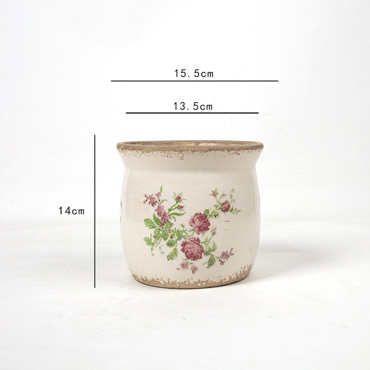 Decorative ceramic plant container with artistic design