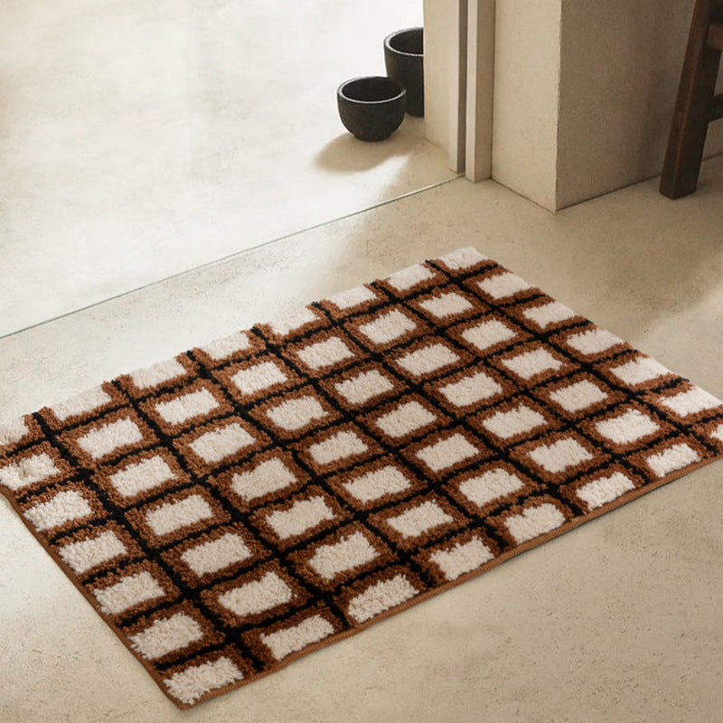 Short pile bath mat with geometric check pattern and non-slip backing
