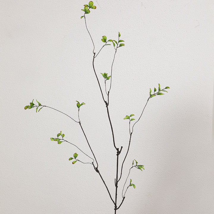 Artificial flower branch with vibrant orange flowers