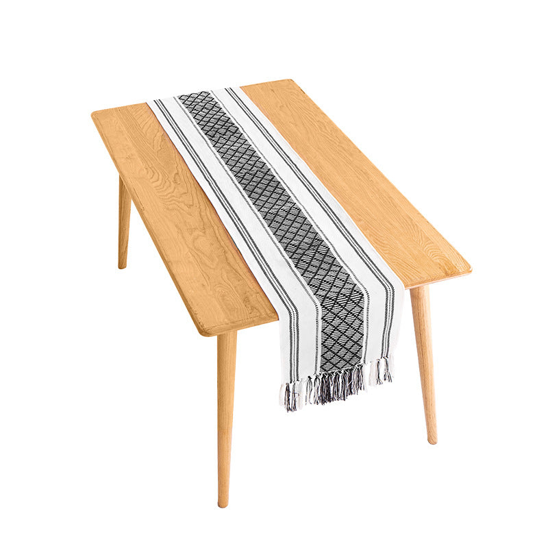 Handwoven cotton table runner with ethnic diamond pattern and fringes