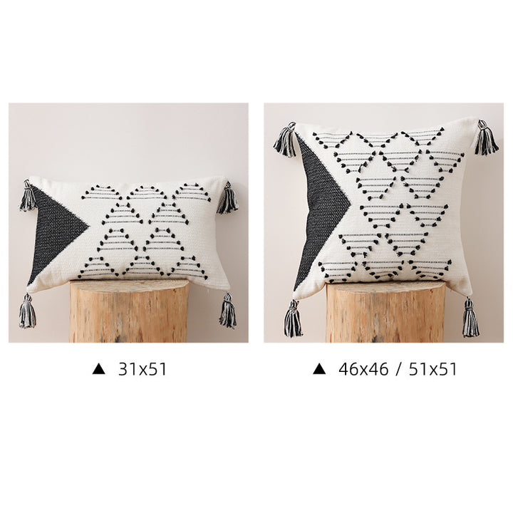 Decorative woven cushion cover with geometric tuft-relief and tassels