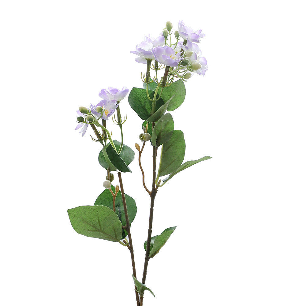 Artificial flower branch with vibrant pink flowers