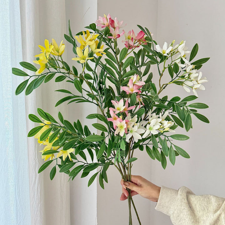 Decorative artificial flower branch with delicate flowers