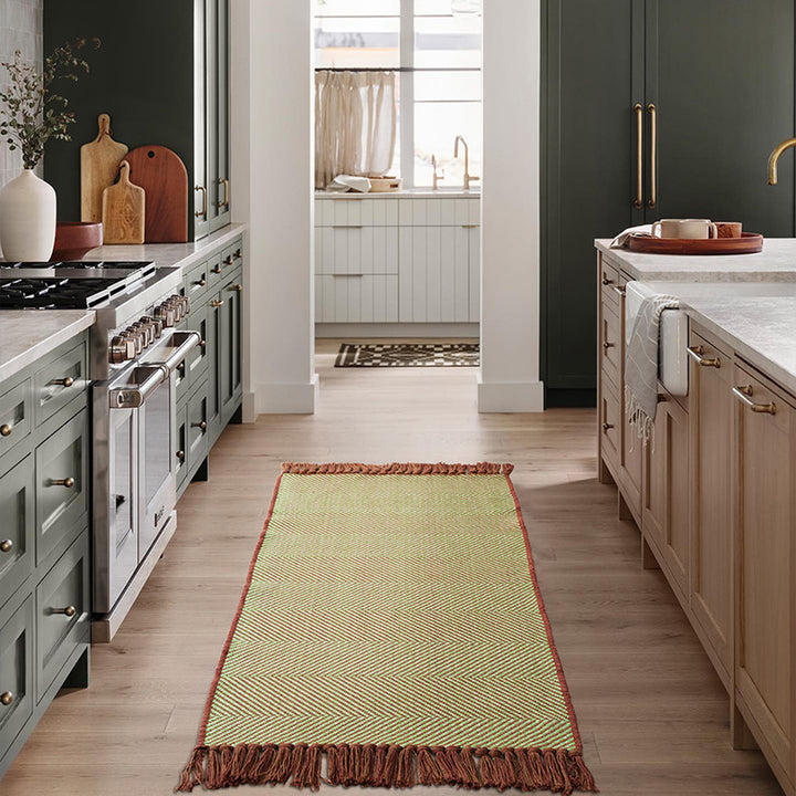 Woven table runner with dense herringbone jacquard and fringes