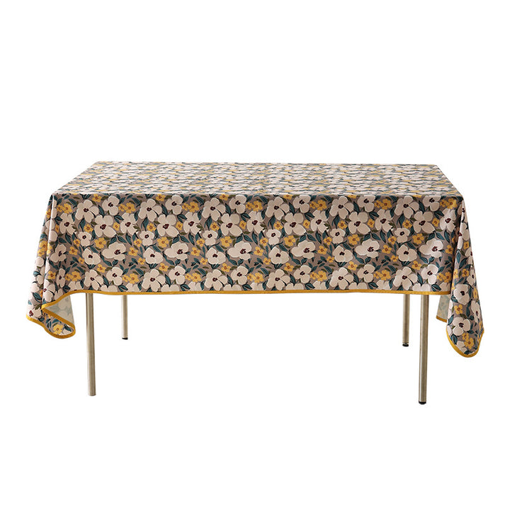 Coated tablecloth in country house style with botanical print and fine hem