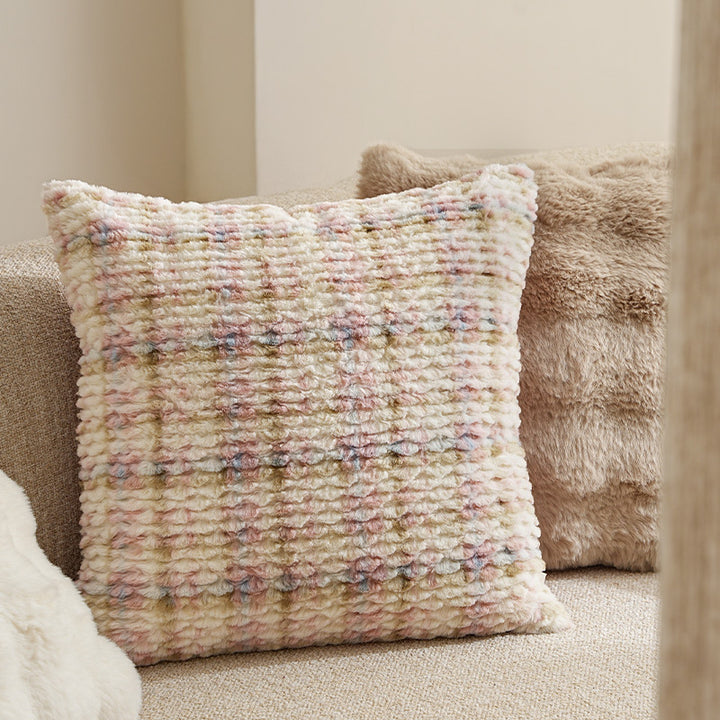 Square decorative cushion made of soft faux fur with inner cushion