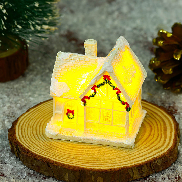 Illuminated Christmas village house with festive decoration
