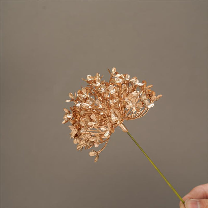 Decorative artificial flower branch with delicate details