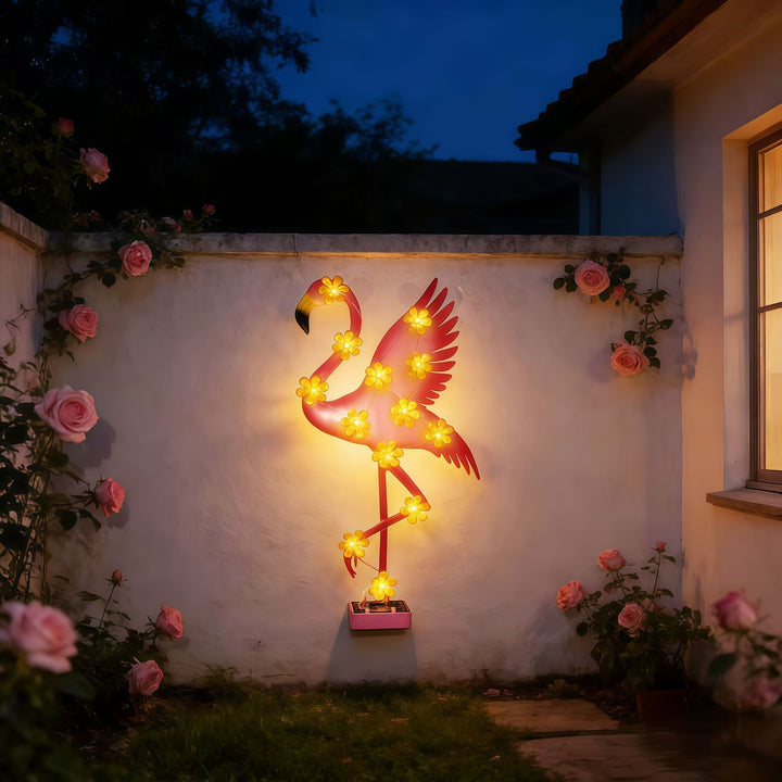 Solar-powered Flamingo LED garden stake light with flower accent lamps