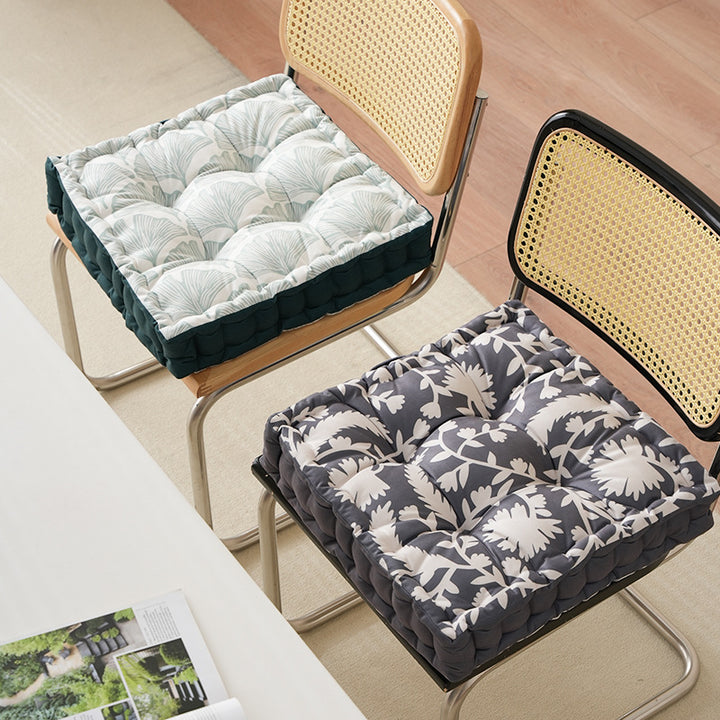 Padded chair cushion with carrying handle and decorative stitching