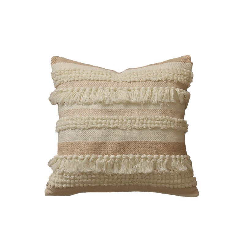 Decorative woven cushion cover with fringes and textured striped design