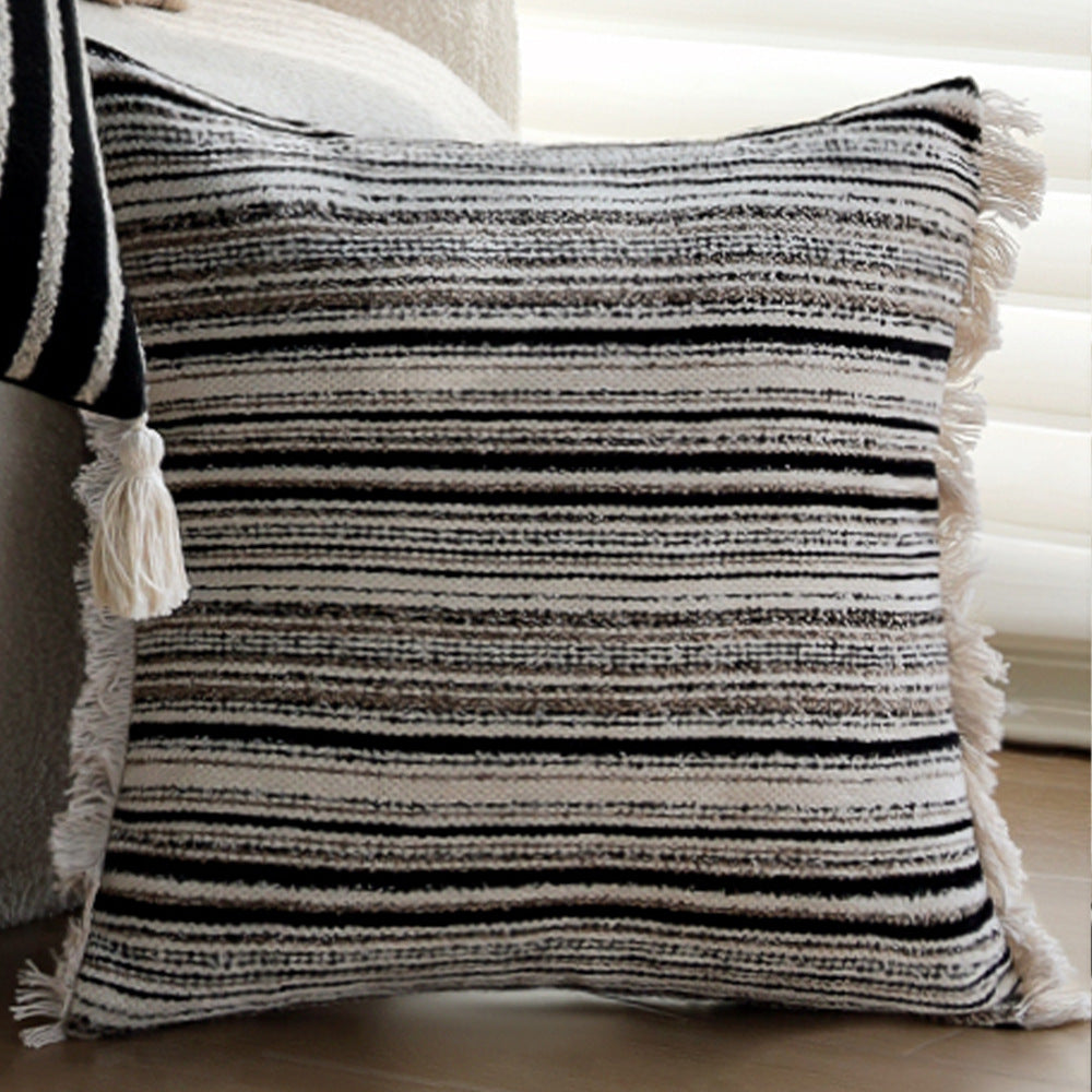 Woven home decor pillow cover with fine striped texture and hand-fringed edge