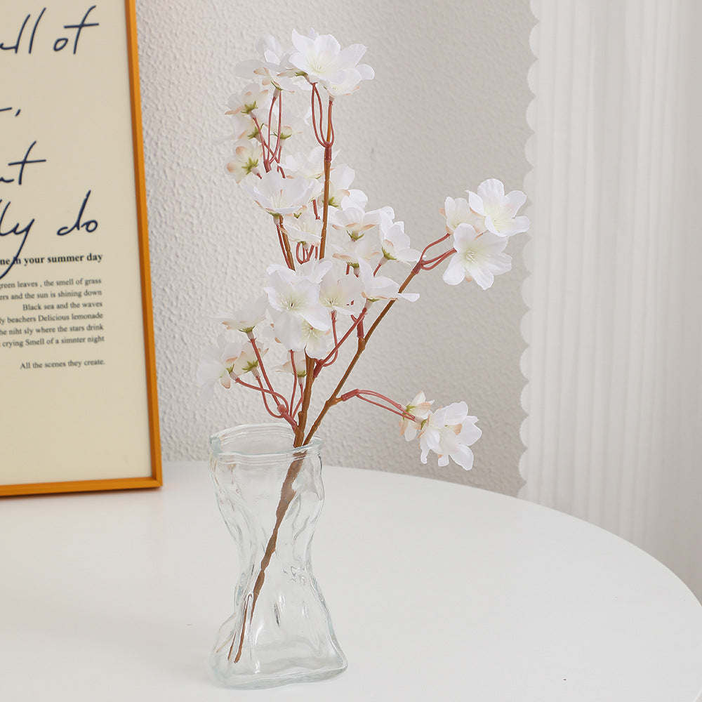 Artificial cherry blossom branch with detail-loving flowers