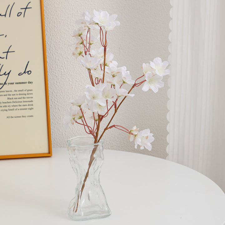 Artificial cherry blossom branch with detail-loving flowers