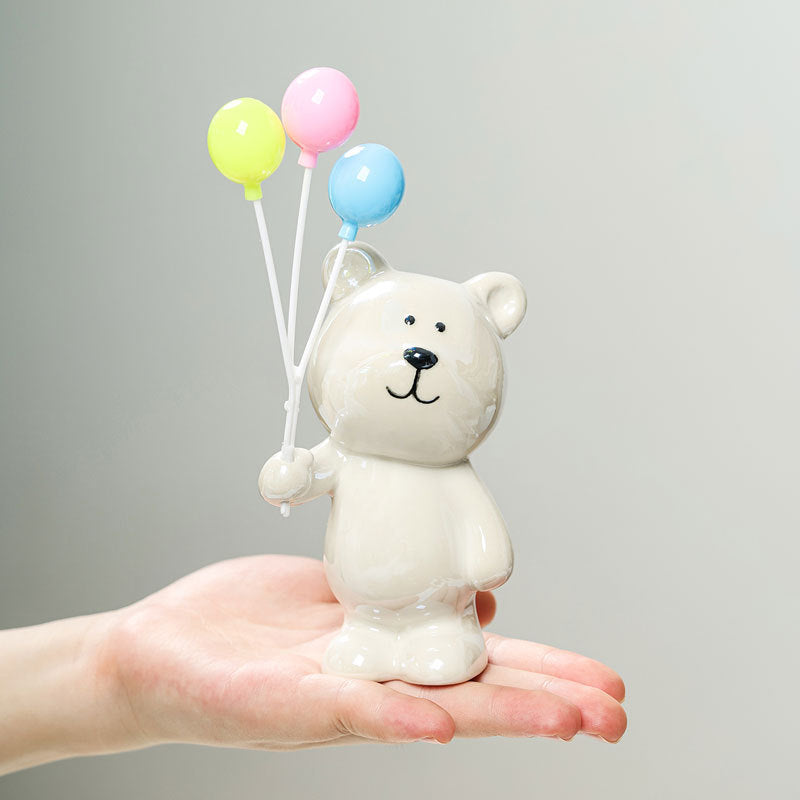 Cute ceramic bear figurine with balloons