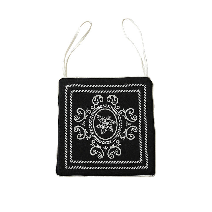 Double-sided seat cushion with ties and decorative jacquard pattern