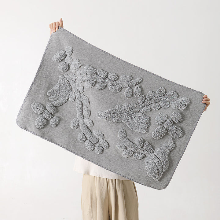 Luxurious organic cotton bath mat with relief pile structure