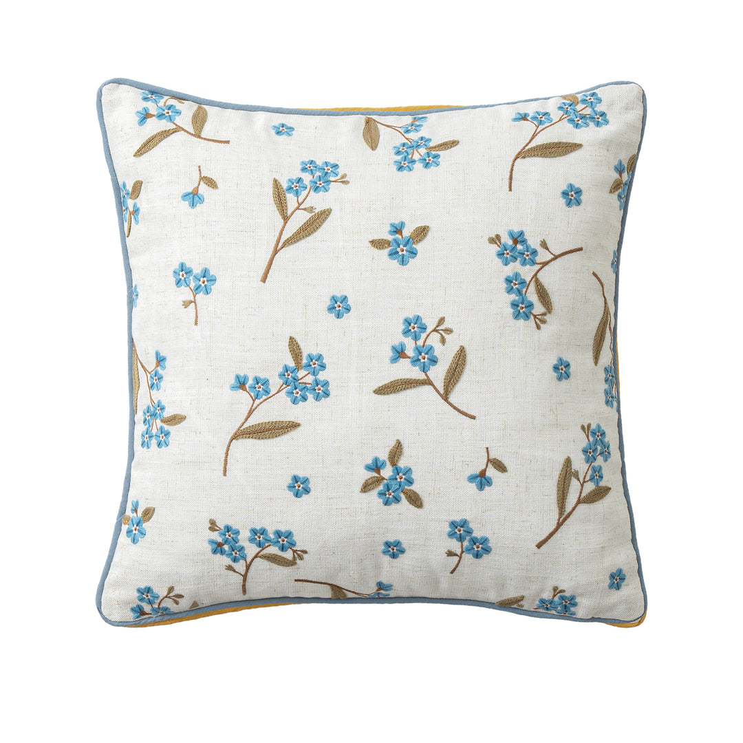 Embroidered linen decorative pillow with floral embroidery and piping