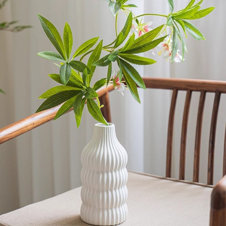 Stylish ceramic vase with wave structure