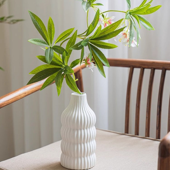 Stylish ceramic vase with wave structure