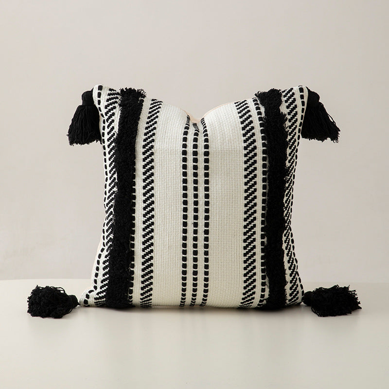 Handwoven decorative cushion cover made of cotton blend with tassels and structured stripe look