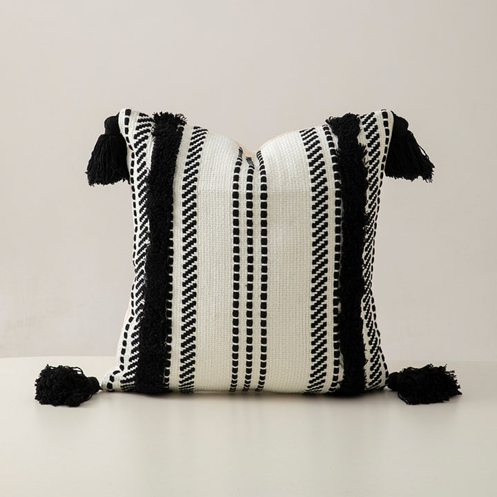 Handwoven decorative cushion cover made of cotton blend with tassels and structured stripe look