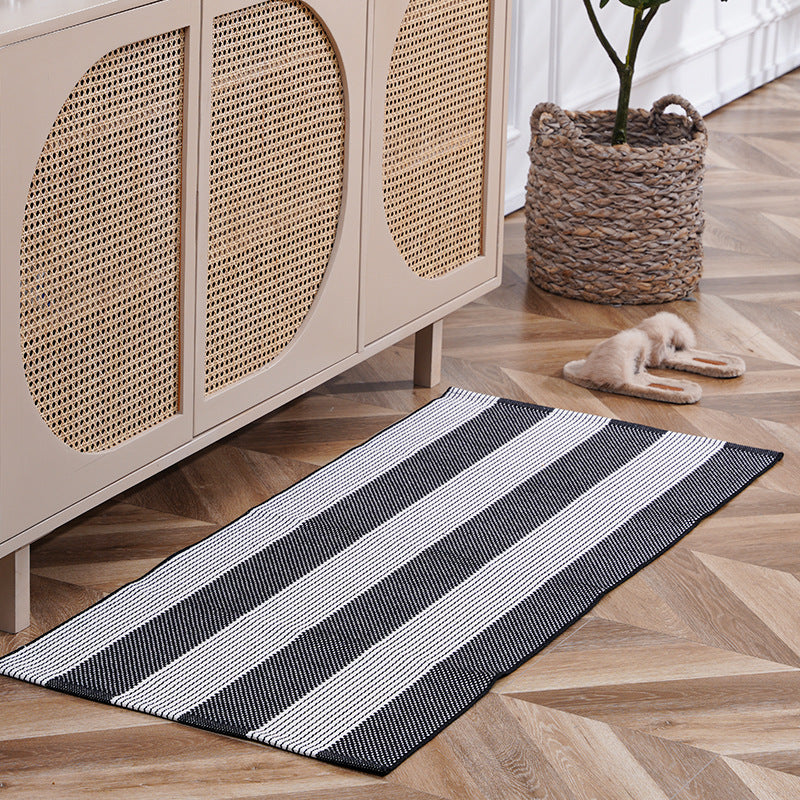 woven living room runner with fringes and geometric weave pattern