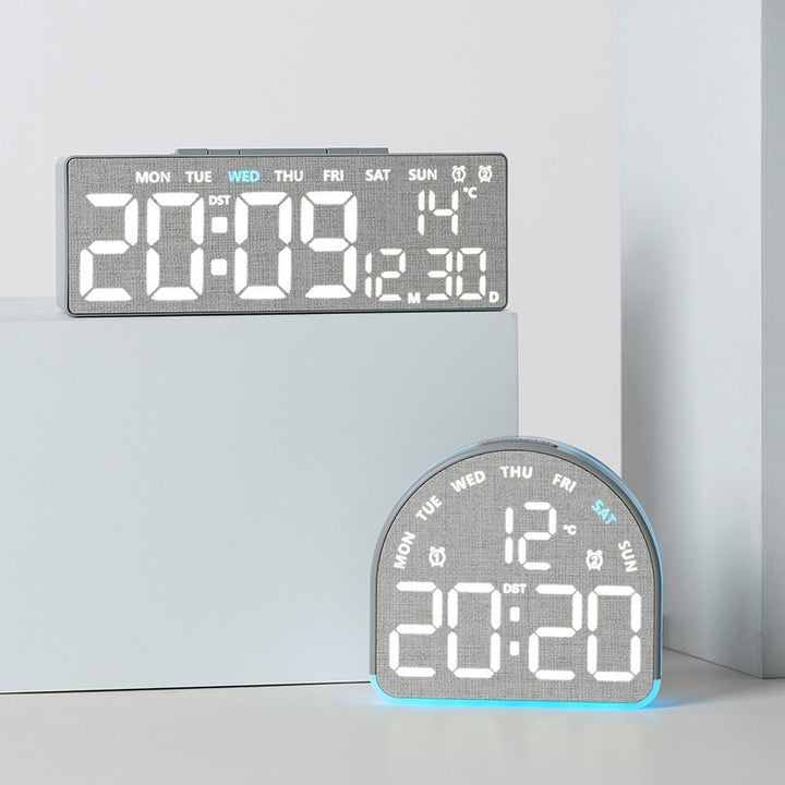 Digital alarm clock with temperature sensor and date display