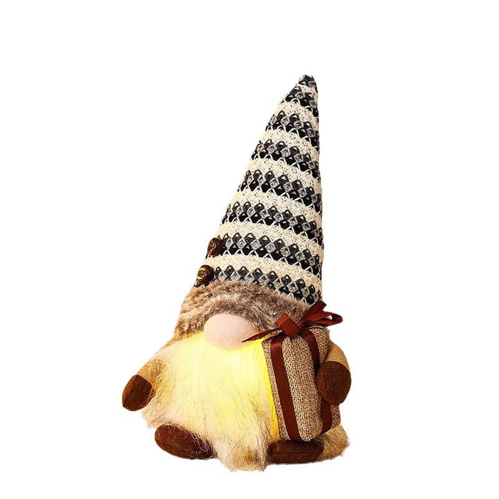 Decorative Christmas gnome with gift package