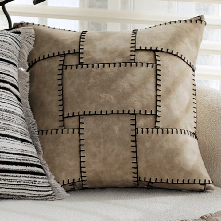 Woven home decor pillow cover with fine striped texture and hand-fringed edge