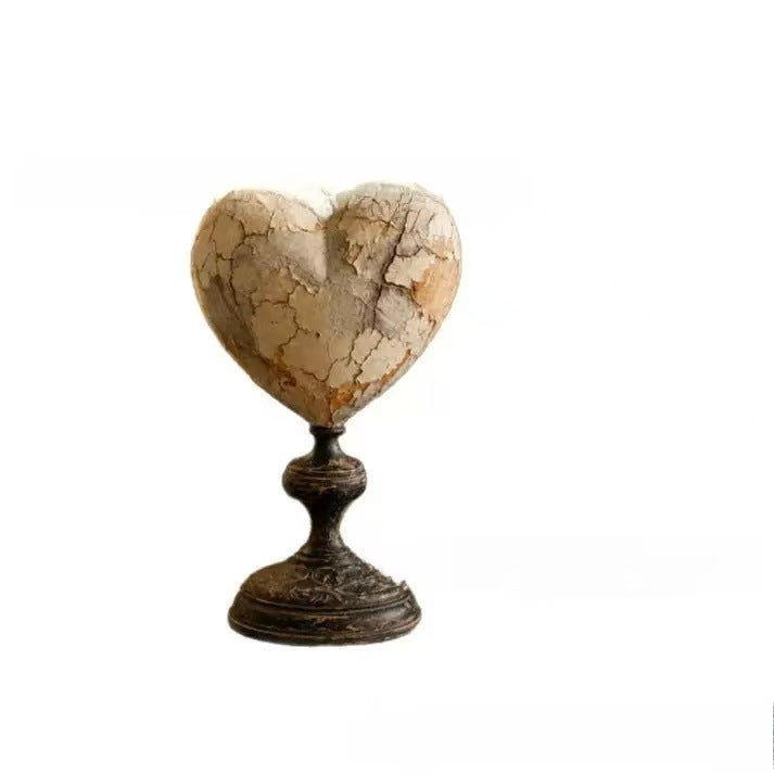 Decorative heart sculpture with bird motif