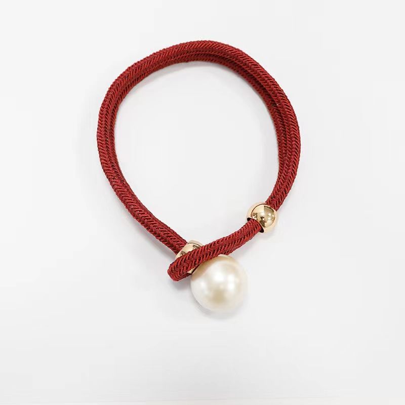Elegant curtain tieback with decorative pearl